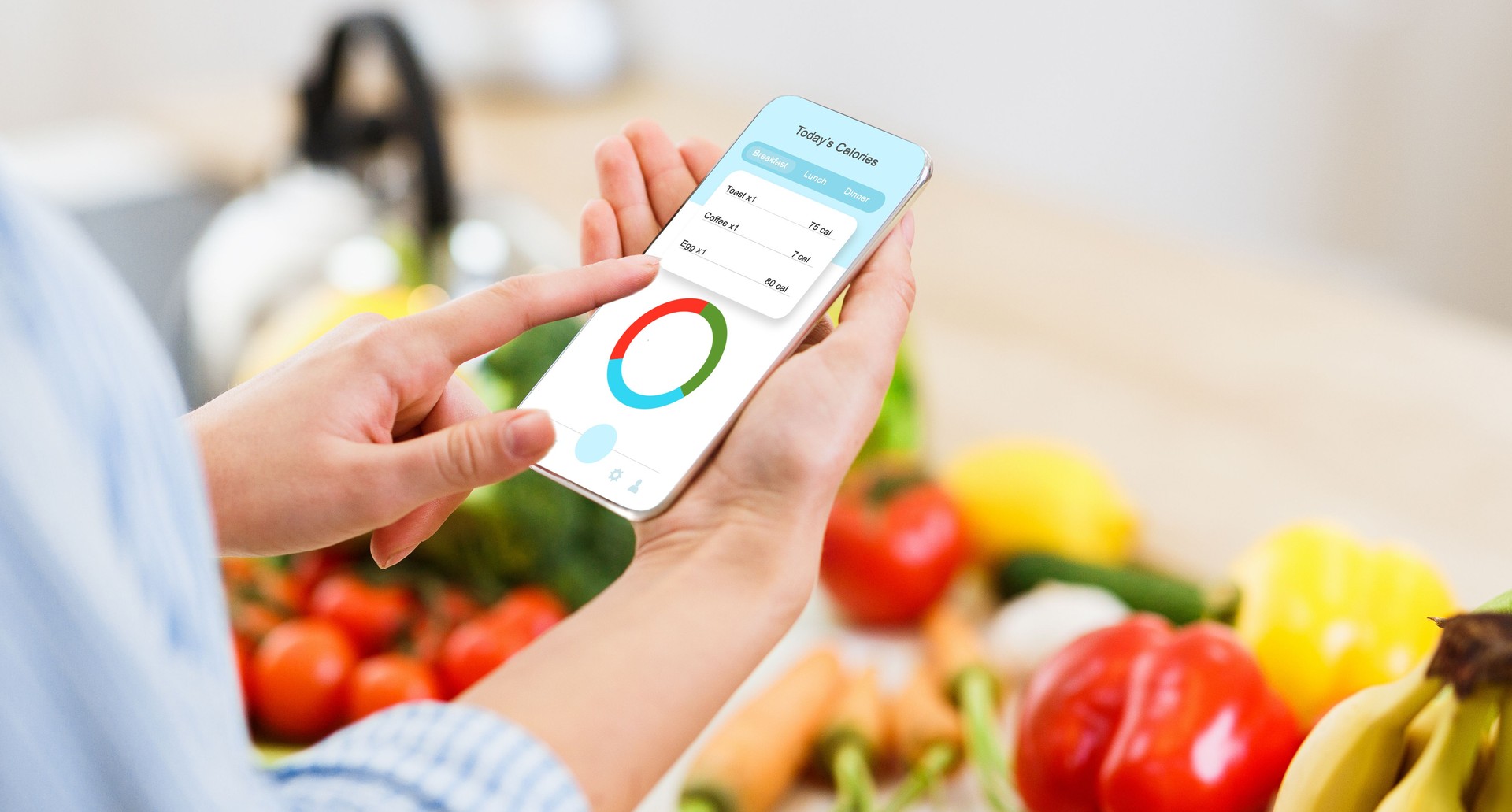 Woman using calorie counter application on her smartphone while cooking healthy lunch